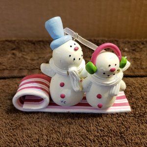 Christmas Ornament Snowmen Riding a Realistic Peppermint Taffy Candy Sled